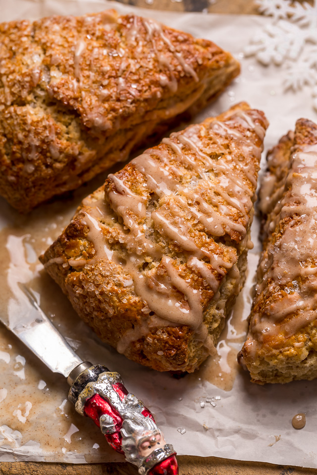 These Bakery-Style Eggnog Scones are flaky, buttery, and loaded with eggnog flavor! Topped with a sweet eggnog glaze, they're perfect for Christmas morning! Best served warm, with a cup of coffee or tea!