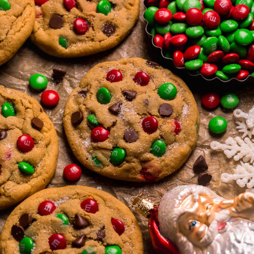 Santa's Favorite Peanut Butter M&M Cookies are thick, soft, and chewy! These GIANT bakery-style holiday cookies are loaded with peanut butter, M&Ms, and gooey milk chocolate chips! A crowd-pleasing cookie recipe that's loved equally by kiddos and adults!