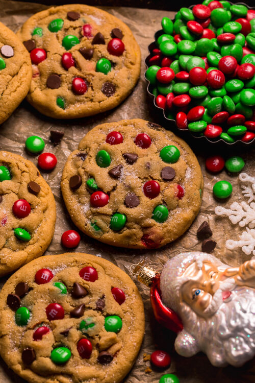 Santa's Favorite Peanut Butter M&M Cookies are thick, soft, and chewy! These GIANT bakery-style holiday cookies are loaded with peanut butter, M&Ms, and gooey milk chocolate chips! A crowd-pleasing cookie recipe that's loved equally by kiddos and adults!