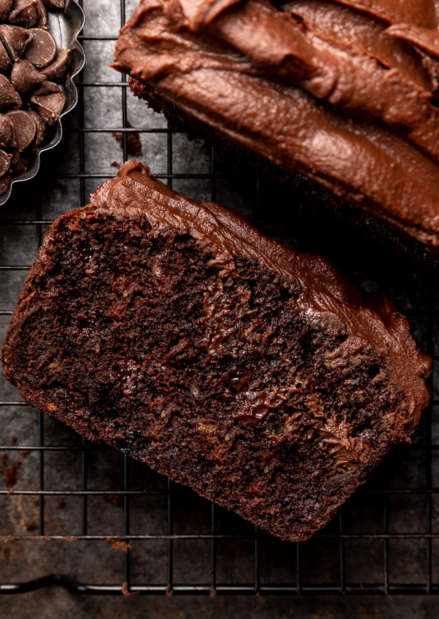 This Extra Moist Chocolate Banana Cake is topped with Espresso Chocolate Ganache! Baked in a load pan, this is a great snacking cake! A great recipe for the when you have ripe bananas and want to bake something other than banana bread!