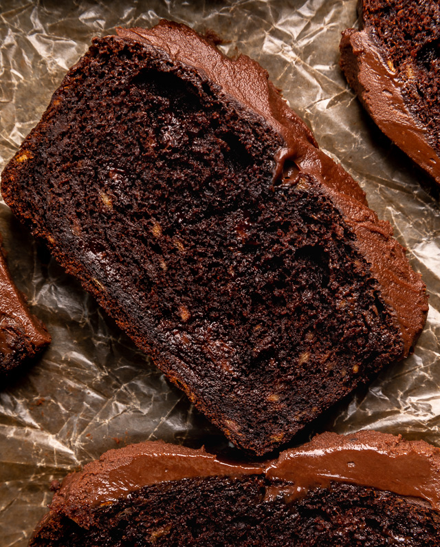 This Extra Moist Chocolate Banana Cake is topped with Espresso Chocolate Ganache! Baked in a load pan, this is a great snacking cake! A great recipe for the when you have ripe bananas and want to bake something other than banana bread!
