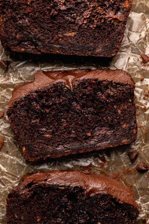 This Extra Moist Chocolate Banana Cake is topped with Espresso Chocolate Ganache! Baked in a load pan, this is a great snacking cake! A great recipe for the when you have ripe bananas and want to bake something other than banana bread!
