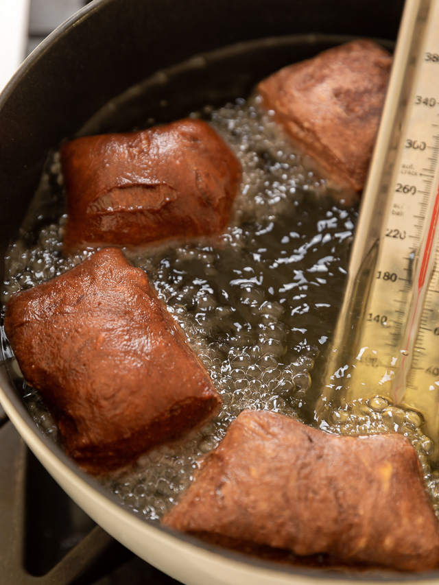 The only thing better than Beignets are Chocolate Filled Beignets! These golden brown treats are light, fluffy, and filled with a gooey pocket of chocolate. If you love beignets and chocolate, you have to try this recipe!