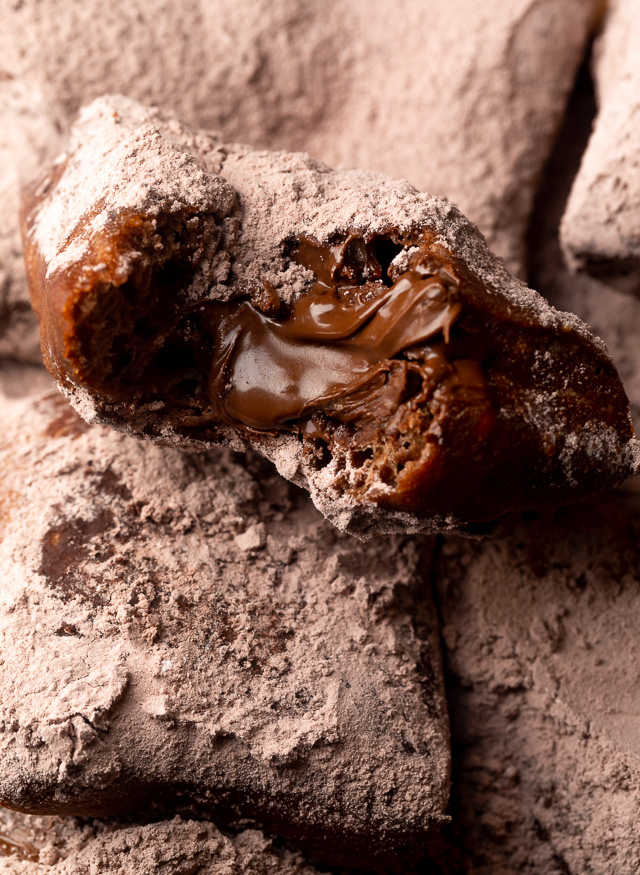 The only thing better than Beignets are Chocolate Filled Beignets! These golden brown treats are light, fluffy, and filled with a gooey pocket of chocolate. If you love beignets and chocolate, you have to try this recipe!