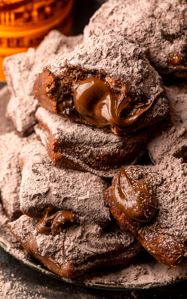 The only thing better than Beignets are Chocolate Filled Beignets! These golden brown treats are light, fluffy, and filled with a gooey pocket of chocolate. If you love beignets and chocolate, you have to try this recipe!