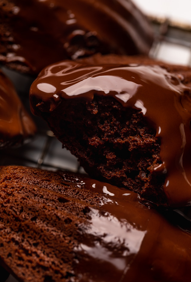 My Double Chocolate Madeleines are fluffy, cakey, and perfect for dunking in tea or coffee! A sweet treat that's sure to please the chocolate lovers in your life! So bust out your madeleine pan and let's get baking!