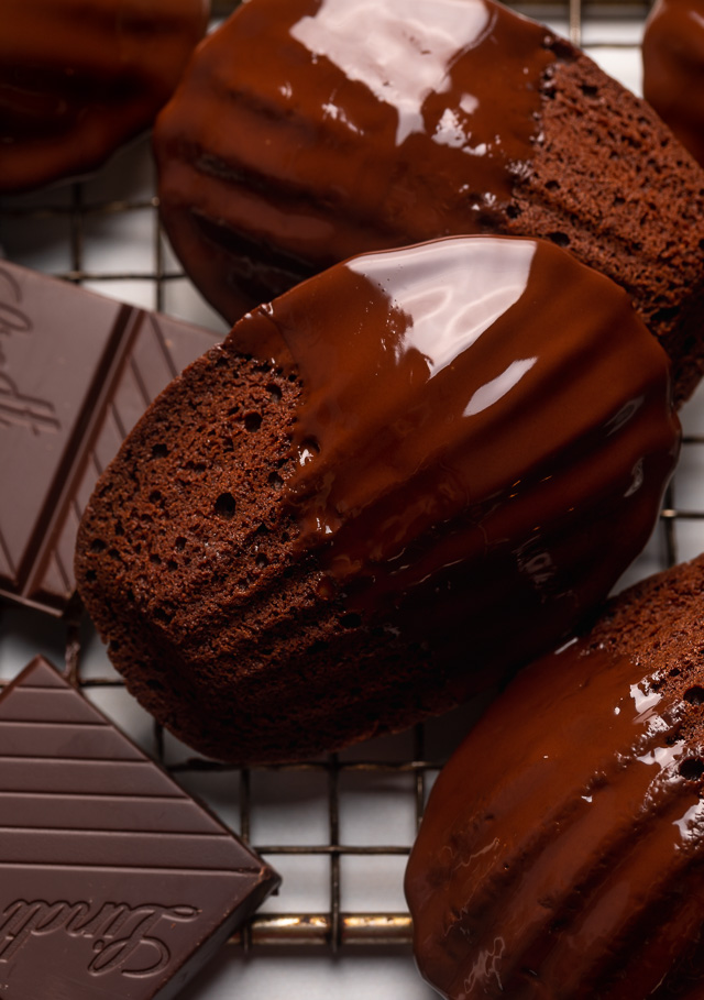 My Double Chocolate Madeleines are fluffy, cakey, and perfect for dunking in tea or coffee! A sweet treat that's sure to please the chocolate lovers in your life! So bust out your madeleine pan and let's get baking!
