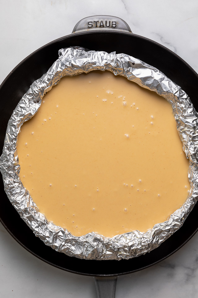 This Chocolate Covered Peanut Butter Cheesecake is ultra creamy and the perfect marriage of chocolate and peanut butter! Featuring an oreo crust, creamy peanut butter cheesecake filling, and topped with with peanut butter chocolate ganache and peanut butter cups, it's a true showstopper! And any leftovers freeze great!