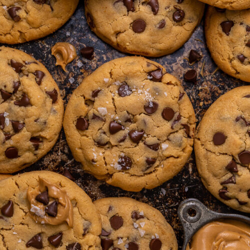 These Bakery-Style Chocolate Chip Cookies are super thick, rich in peanut butter flavor, and loaded with gooey chocolate chips! Press extra chocolate chips on top and sprinkle with sea salt for an impressive presentation! A great recipe for anyone who loves the combination of chocolate and peanut butter!