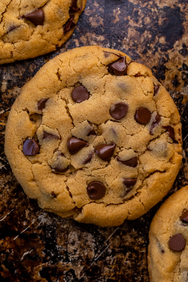 These Bakery-Style Chocolate Chip Cookies are super thick, rich in peanut butter flavor, and loaded with gooey chocolate chips! Press extra chocolate chips on top and sprinkle with sea salt for an impressive presentation! A great recipe for anyone who loves the combination of chocolate and peanut butter!