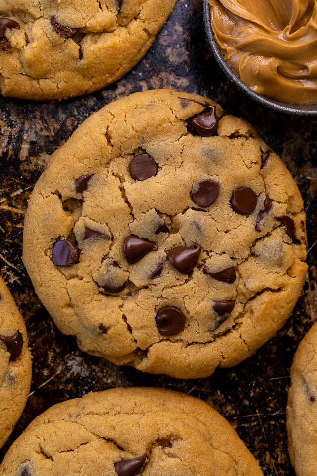 These Bakery-Style Chocolate Chip Cookies are super thick, rich in peanut butter flavor, and loaded with gooey chocolate chips! Press extra chocolate chips on top and sprinkle with sea salt for an impressive presentation! A great recipe for anyone who loves the combination of chocolate and peanut butter!
