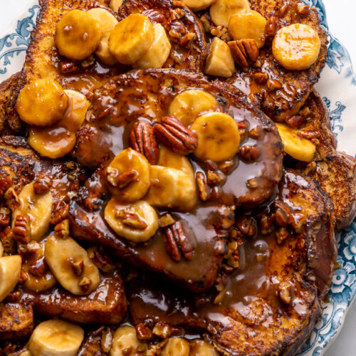 This Easy Bananas Foster French Toast is one of our favorite breakfast recipes! Crispy slices of buttery brioche are topped with a delicious homemade bananas foster sauce made from dark rum, butter, brown sugar, heavy cream, and crunchy pecans. Delicious on it's on, but devilishly good with whipped cream or vanilla ice cream!