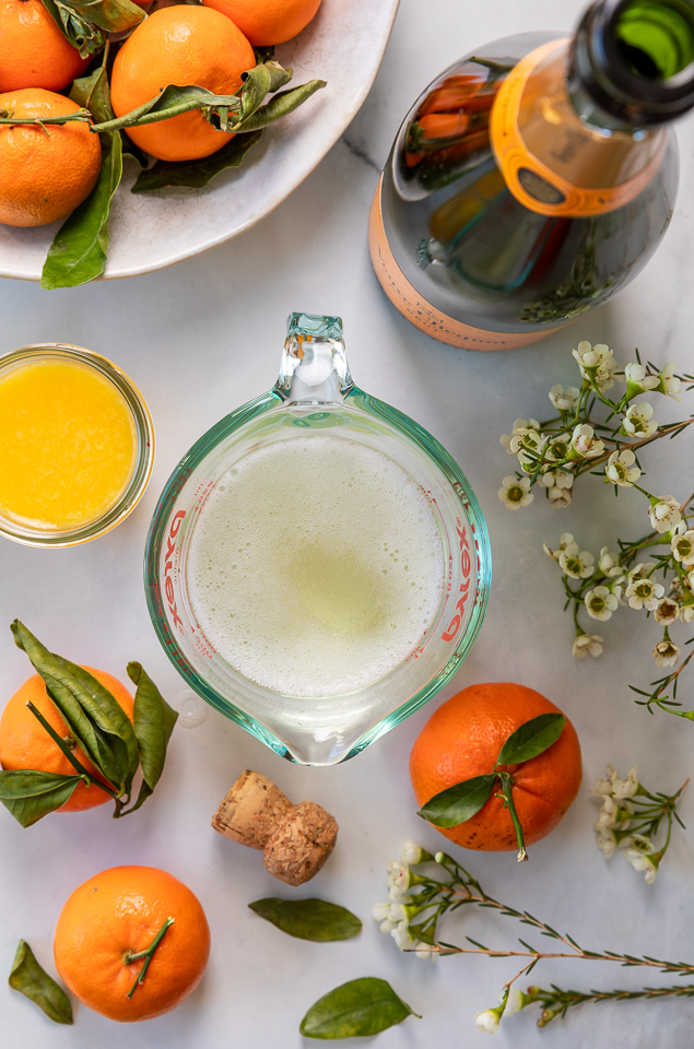 Today I'm teaching you how to make Mimosa Cupcakes! Light and fluffy, these delicious cupcakes are made with freshly squeezed orange juice, orange zest, and of course, CHAMPAGNE! One of my favorite cupcake recipes for brunch or special occasions like Easter, Mother's Day, or New Year's Eve!