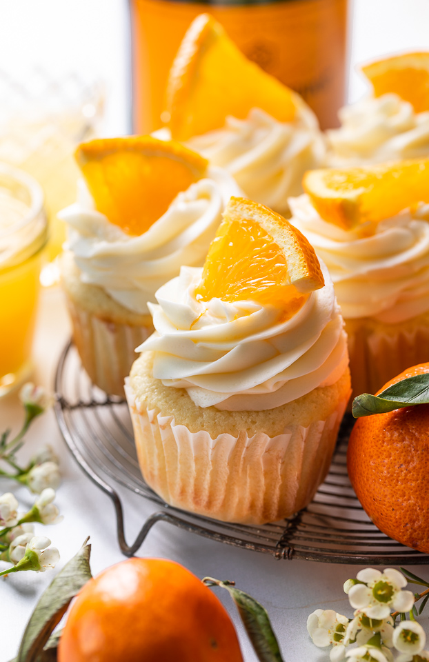 Today I'm teaching you how to make Mimosa Cupcakes! Light and fluffy, these delicious cupcakes are made with freshly squeezed orange juice, orange zest, and of course, CHAMPAGNE! One of my favorite cupcake recipes for brunch or special occasions like Easter, Mother's Day, or New Year's Eve!