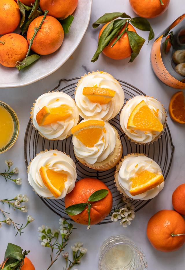 Today I'm teaching you how to make Mimosa Cupcakes! Light and fluffy, these delicious cupcakes are made with freshly squeezed orange juice, orange zest, and of course, CHAMPAGNE! One of my favorite cupcake recipes for brunch or special occasions like Easter, Mother's Day, or New Year's Eve!