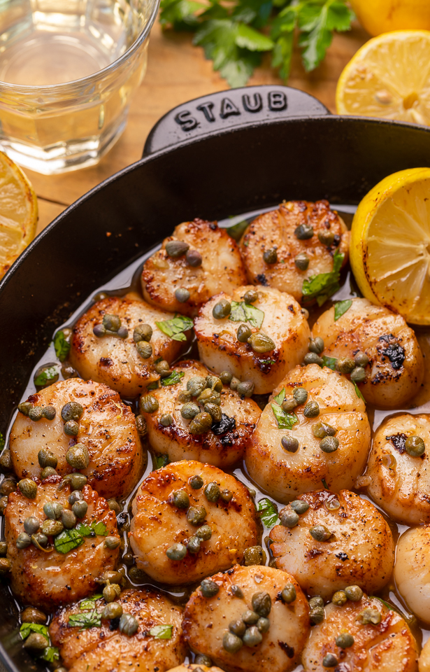 Perfectly pan seared scallops are served in a delicious white wine lemon caper sauce! This special occasion recipe is so easy and comes together in less than 20 minutes! Just be sure not to overcook your scallops, only cook for 1 minute and 30 seconds or so per side!