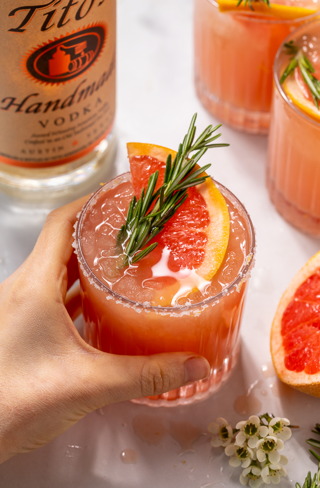 Made with gin or vodka and grapefruit juice, this classic cocktail is so easy and always a crowd-pleaser! Served in a highball glass with a salted rim, this drink is perfect for brunch or Summer parties! Just be sure to use fresh grapefruit juice, it really makes all the difference!