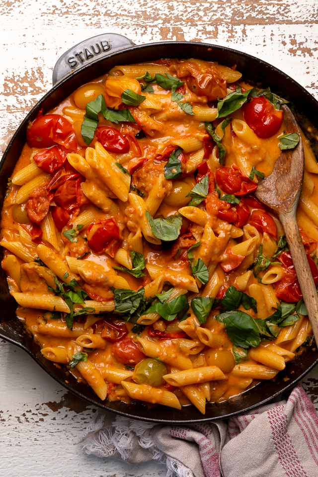 Fresh Tomato Basil Penne alla Vodka is rich, creamy, and so flavorful! The vodka sauce is made with olive oil, a bounty of fresh cherry tomatoes, plenty of garlic, and just a touch of crushed red pepper flakes - plus vodka, cream, and tons of fresh basil! This restaurant quality penne alla vodka recipe is sure to become a family favorite!