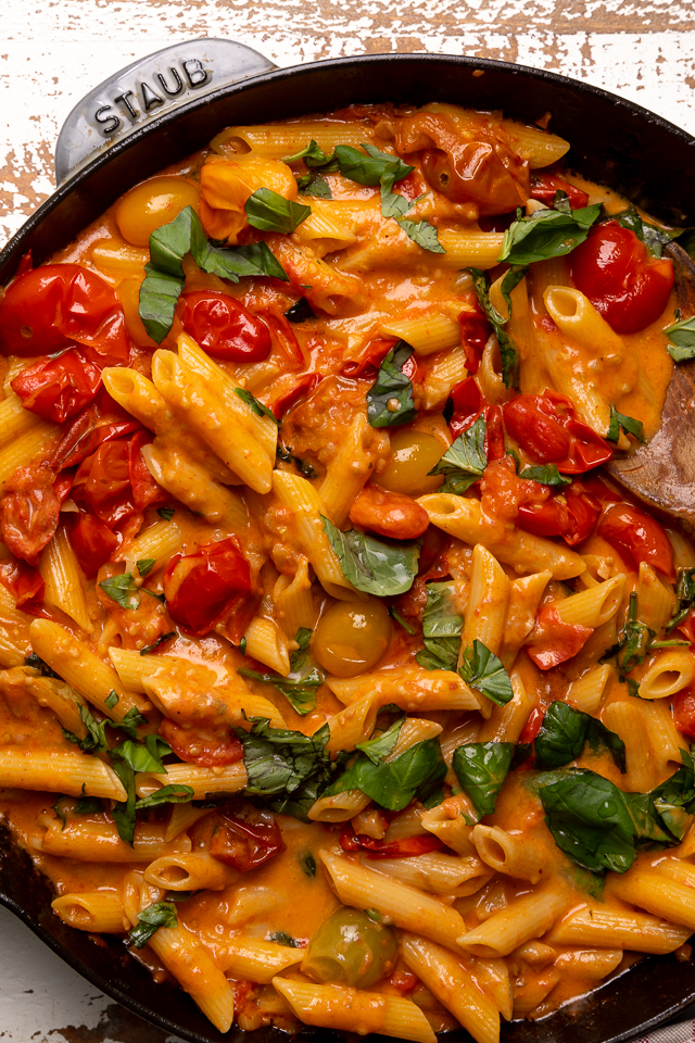 Fresh Tomato Basil Penne alla Vodka is rich, creamy, and so flavorful! The vodka sauce is made with olive oil, a bounty of fresh cherry tomatoes, plenty of garlic, and just a touch of crushed red pepper flakes - plus vodka, cream, and tons of fresh basil! This restaurant quality penne alla vodka recipe is sure to become a family favorite!