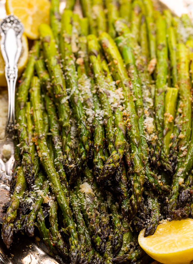 This Lemon Garlic Parmesan Asparagus is a quick and easy side dish that's ready in less than 20 minutes! Perfect with grilled meat, seafood, or a ball of burrata and some charred bread! No matter what you serve it with, I just know you're going to love this recipe!