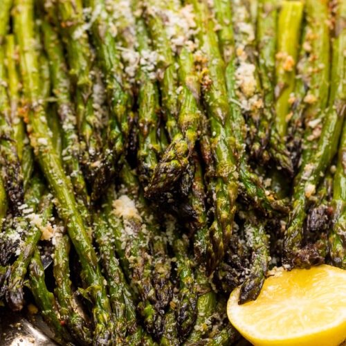 This Lemon Garlic Parmesan Asparagus is a quick and easy side dish that's ready in less than 20 minutes! Perfect with grilled meat, seafood, or a ball of burrata and some charred bread! No matter what you serve it with, I just know you're going to love this recipe!