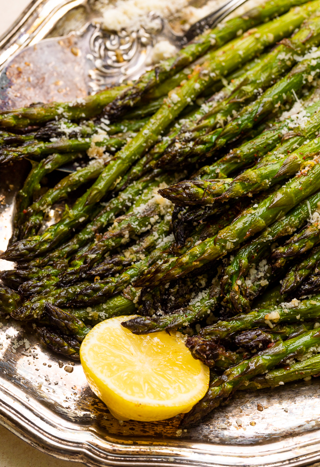 This Lemon Garlic Parmesan Asparagus is a quick and easy side dish that's ready in less than 20 minutes! Perfect with grilled meat, seafood, or a ball of burrata and some charred bread! No matter what you serve it with, I just know you're going to love this recipe!