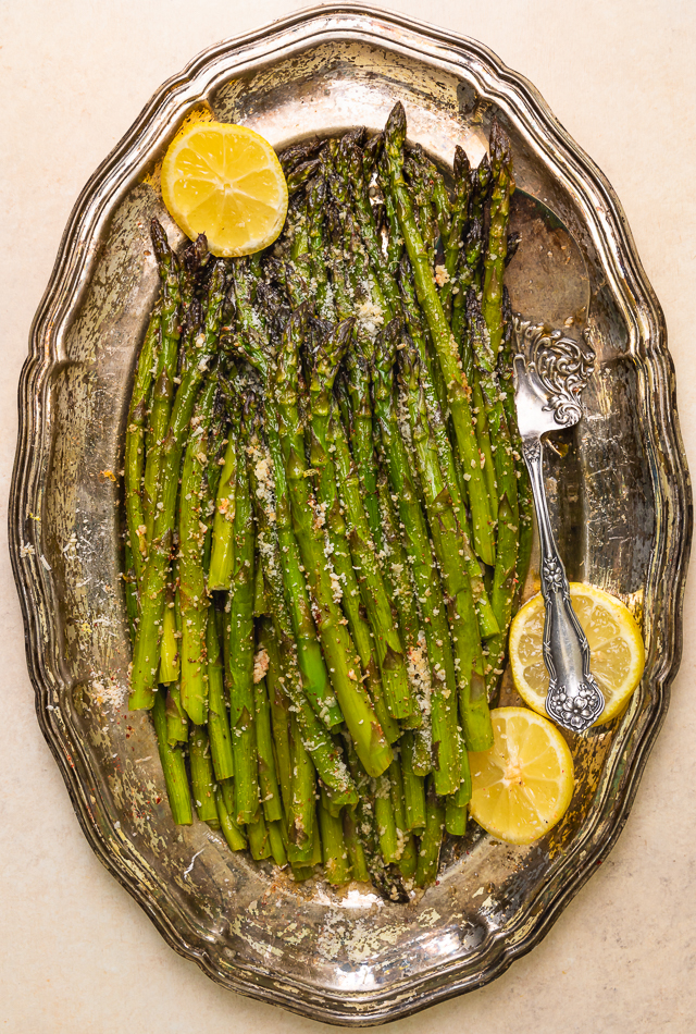 This Lemon Garlic Parmesan Asparagus is a quick and easy side dish that's ready in less than 20 minutes! Perfect with grilled meat, seafood, or a ball of burrata and some charred bread! No matter what you serve it with, I just know you're going to love this recipe!