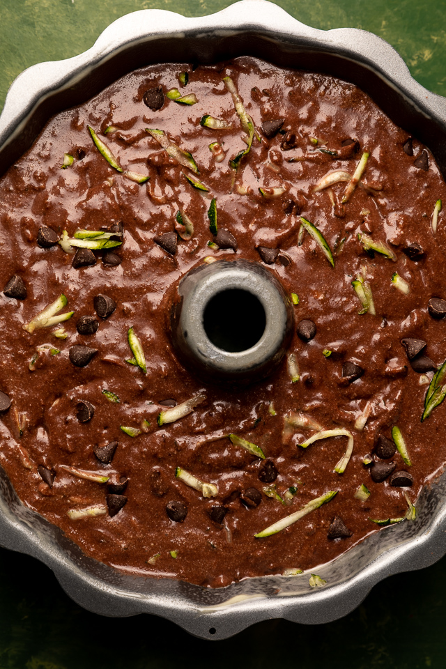 This Chocolate Zucchini Bundt Cake is insanely moist, so fudgy, and loaded with chocolate flavor! No one will even know there's 2 whole cups of shredded zucchini hiding inside! Delicious with chocolate glaze, but can easily be served with whipped cream or a dusting of powdered sugar instead!