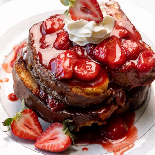 Strawberries and Cream French Toast features buttery slices of brioche bread, fresh strawberries, and whipped cream! A fancy restaurant-quality recipe that's perfect for Easter, Mother's Day, or a bridal shower brunch! This recipe can easily be doubled if you're serving a large crowd!