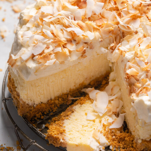 This Creamy Coconut Cheesecake is made with coconut milk, coconut extract, and shredded coconut, so you know it's loaded with refreshing coconut flavor! The crunchy graham cracker crust is the perfect contrast to the creamy filling and fluffy whipped cream topping. A must try for coconut lovers!