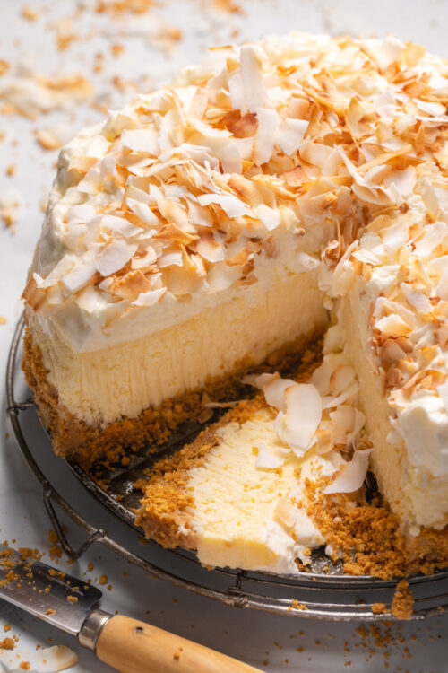 This Creamy Coconut Cheesecake is made with coconut milk, coconut extract, and shredded coconut, so you know it's loaded with refreshing coconut flavor! The crunchy graham cracker crust is the perfect contrast to the creamy filling and fluffy whipped cream topping. A must try for coconut lovers!