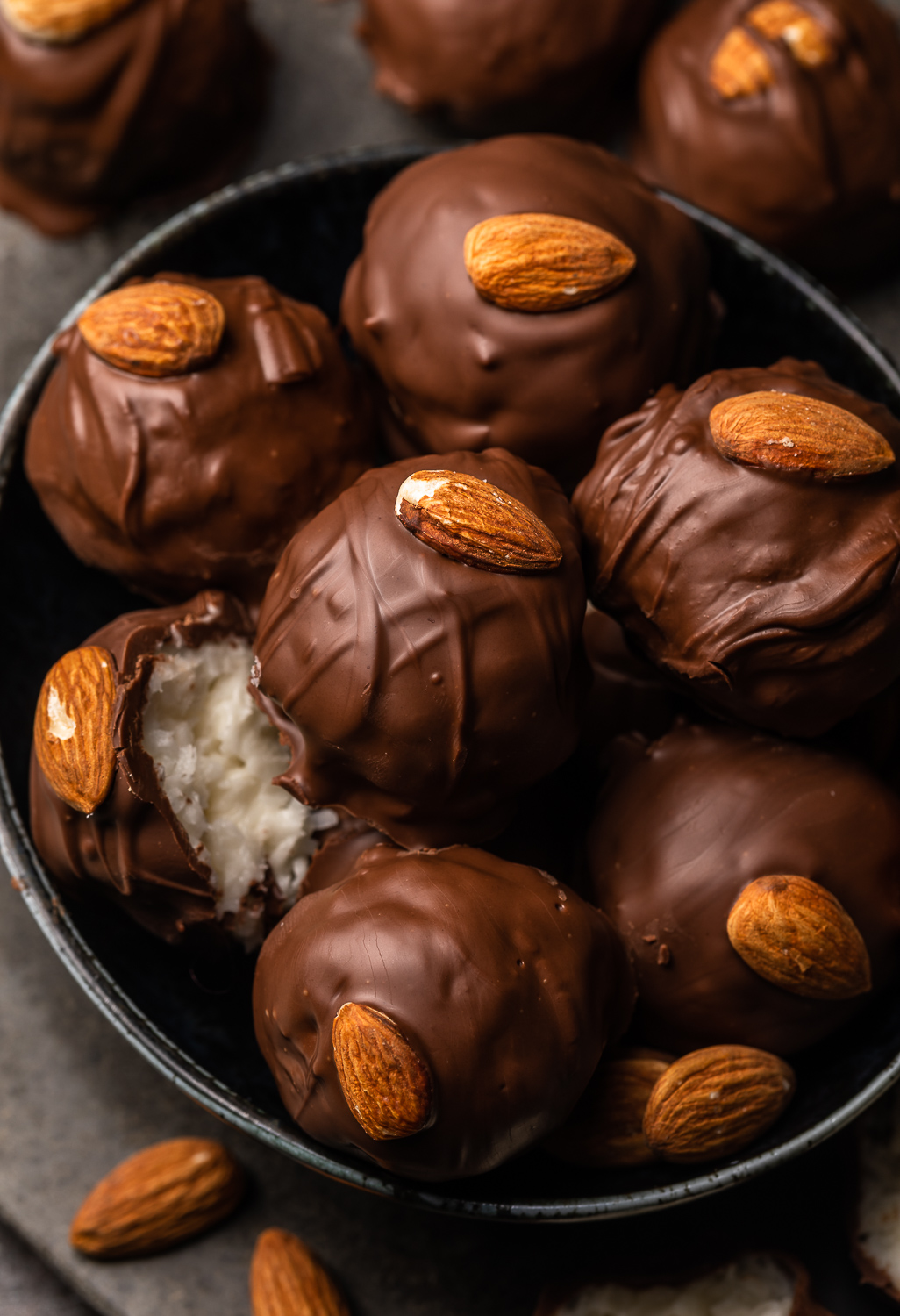 If you like almond joy candy bars, you'll love these almond joy truffles! The coconut mixture is so creamy, it almost tastes like cheesecake, and the rich robe of milk chocolate makes them so decadent! But feel free to dip in dark chocolate for a less sweet treat!