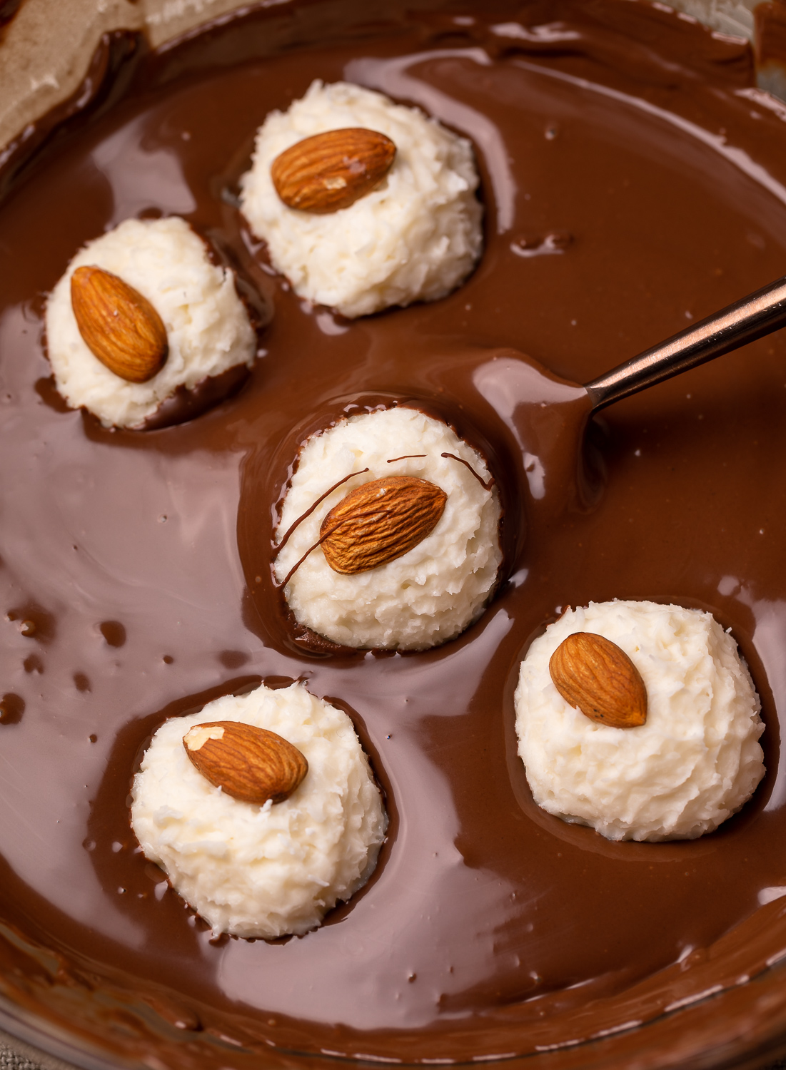 If you like almond joy candy bars, you'll love these almond joy truffles! The coconut mixture is so creamy, it almost tastes like cheesecake, and the rich robe of milk chocolate makes them so decadent! But feel free to dip in dark chocolate for a less sweet treat!