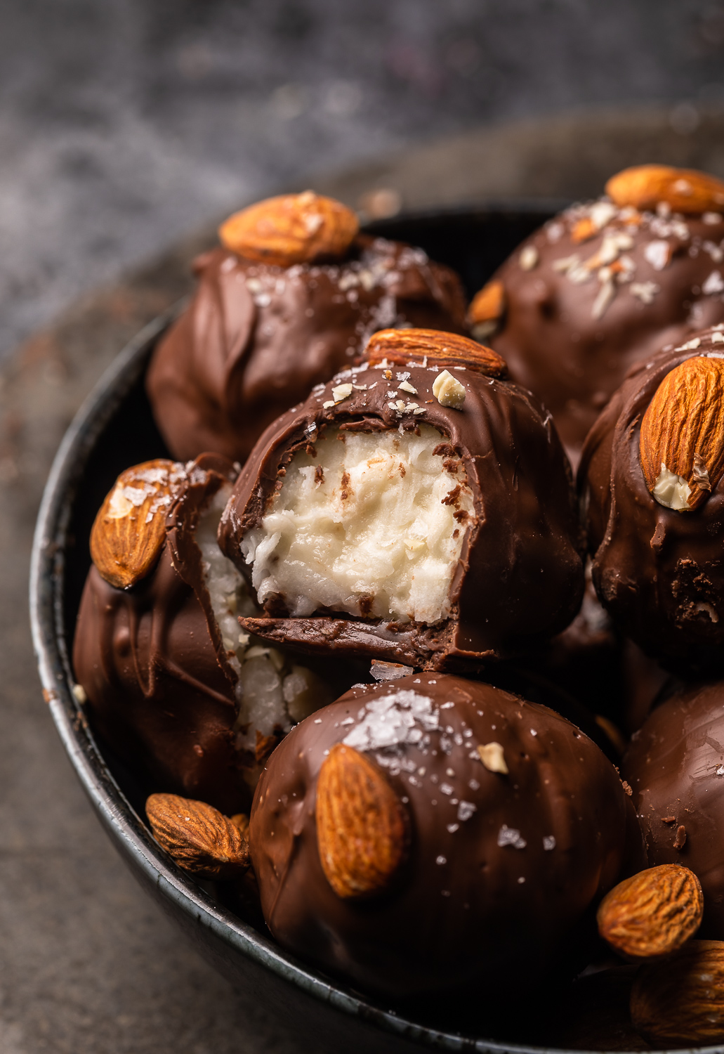 If you like almond joy candy bars, you'll love these almond joy truffles! The coconut mixture is so creamy, it almost tastes like cheesecake, and the rich robe of milk chocolate makes them so decadent! But feel free to dip in dark chocolate for a less sweet treat!