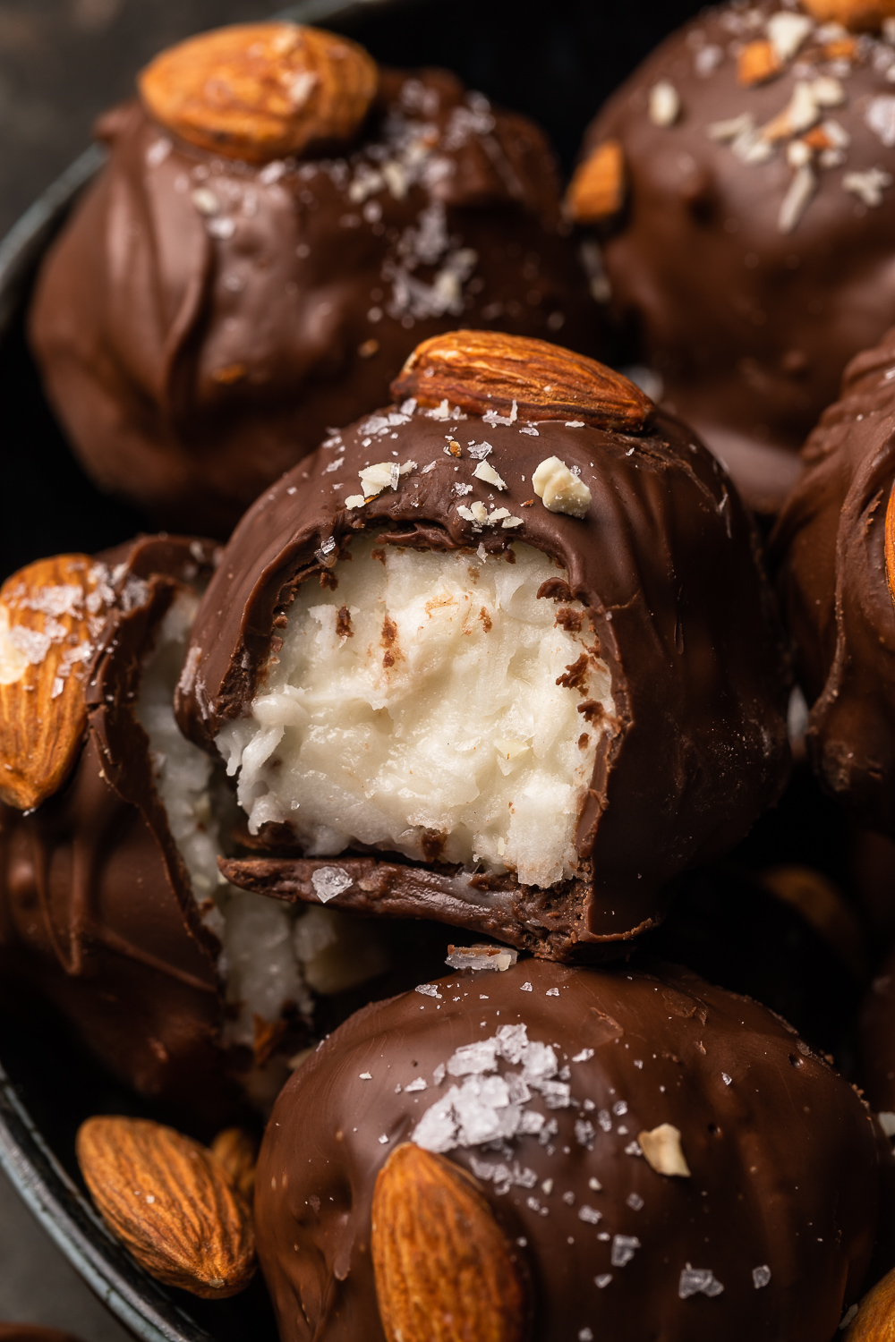If you like almond joy candy bars, you'll love these almond joy truffles! The coconut mixture is so creamy, it almost tastes like cheesecake, and the rich robe of milk chocolate makes them so decadent! But feel free to dip in dark chocolate for a less sweet treat!