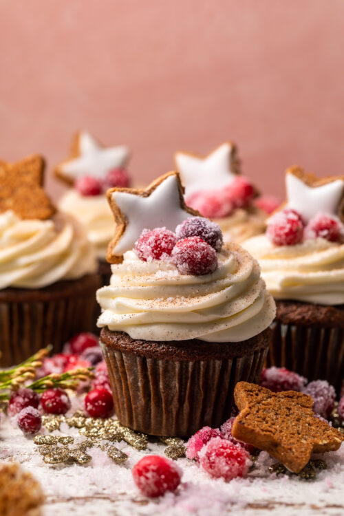 Gingerbread Cupcakes are topped with Mascarpone Frosting and Maple Candied Cranberries! Moist, fluffy, and so flavorful, these are a holiday classic! And the perfect crowd-pleasing holiday dessert recipe for your next party!