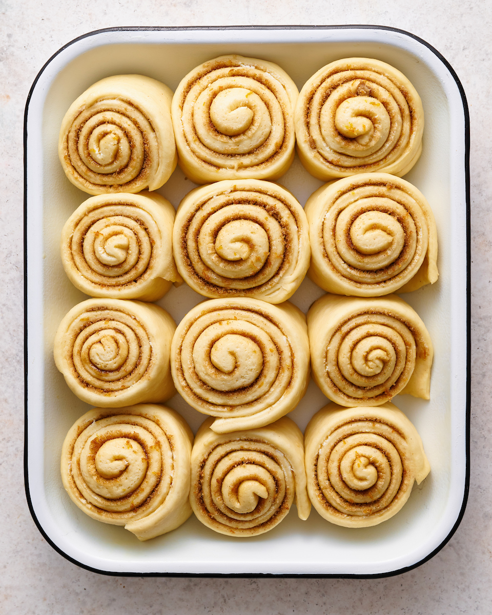 Soft and fluffy orange rolls are loaded with fresh orange flavor and slathered in cream cheese frosting! This special breakfast treat is a Christmas morning tradition in our house... but they're so good we've started making them for Easter, Mother's Day and sometimes, just because! Serve warm, straight from the baking dish!