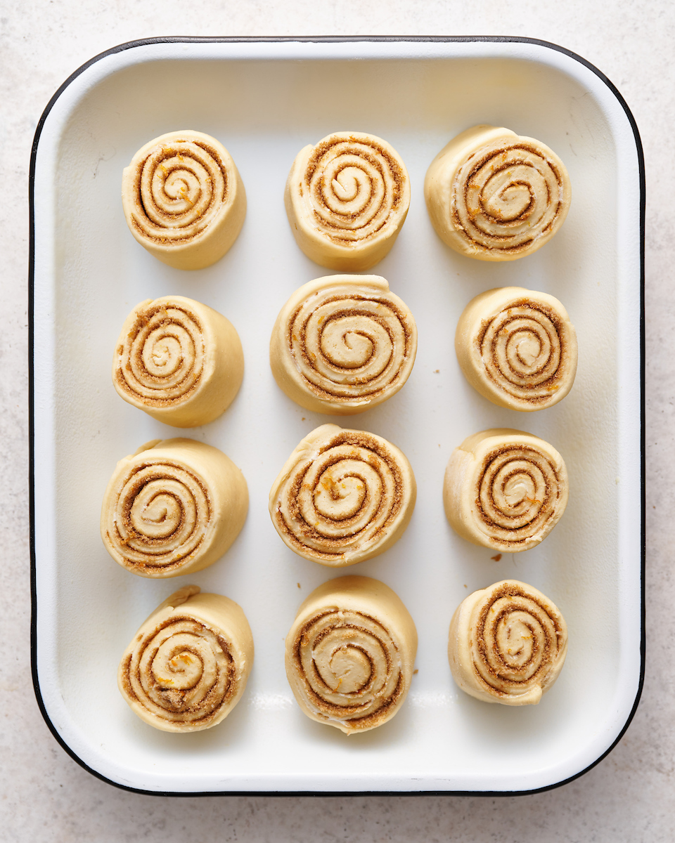 Soft and fluffy orange rolls are loaded with fresh orange flavor and slathered in cream cheese frosting! This special breakfast treat is a Christmas morning tradition in our house... but they're so good we've started making them for Easter, Mother's Day and sometimes, just because! Serve warm, straight from the baking dish!