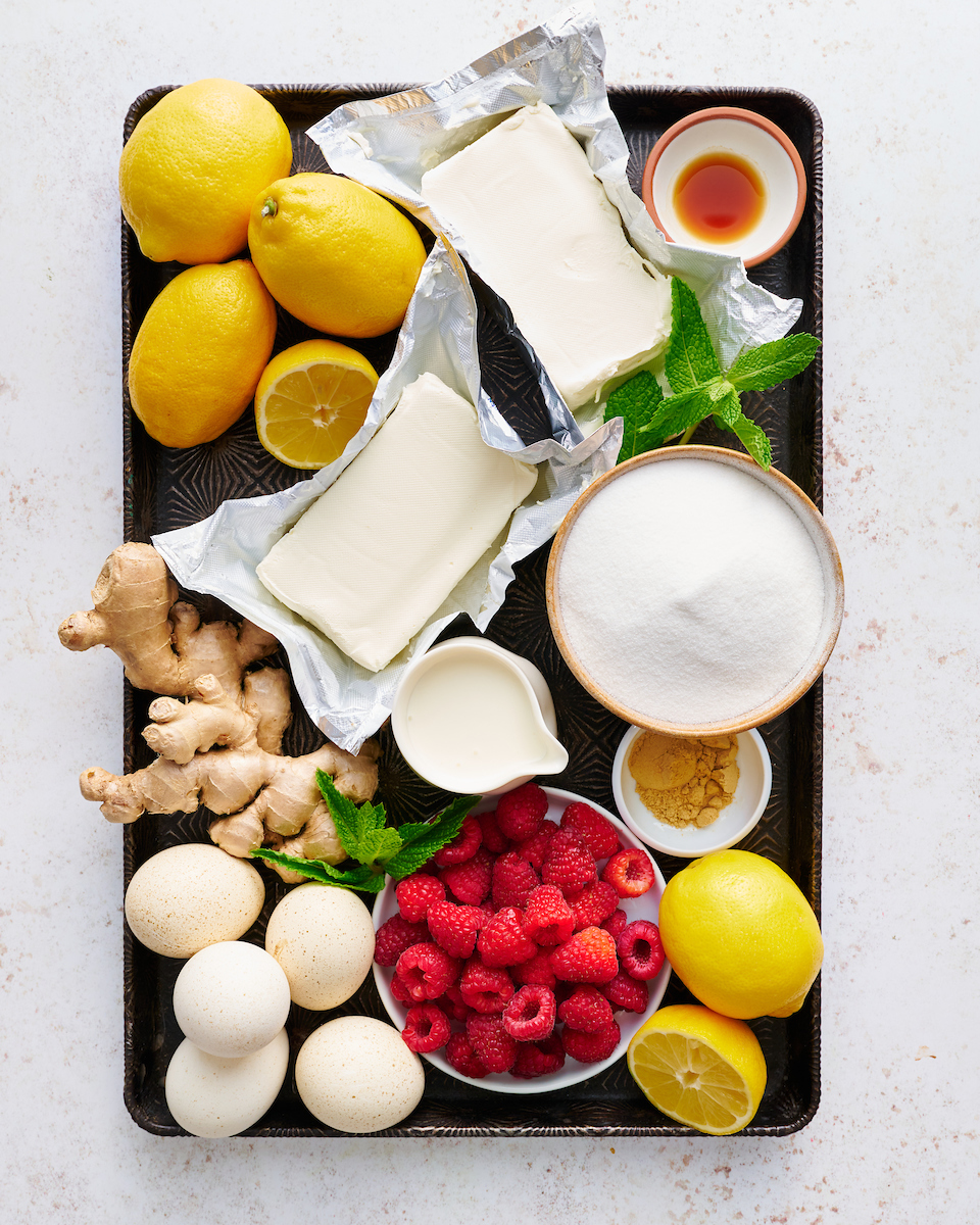 This stunning lemon ginger cheesecake is rich, cream, and silky smooth! Made with fresh ginger, lemon juice, and lemon zest, it's bursting with fresh flavor. The hot pink raspberry sauce makes it a total showstopper!