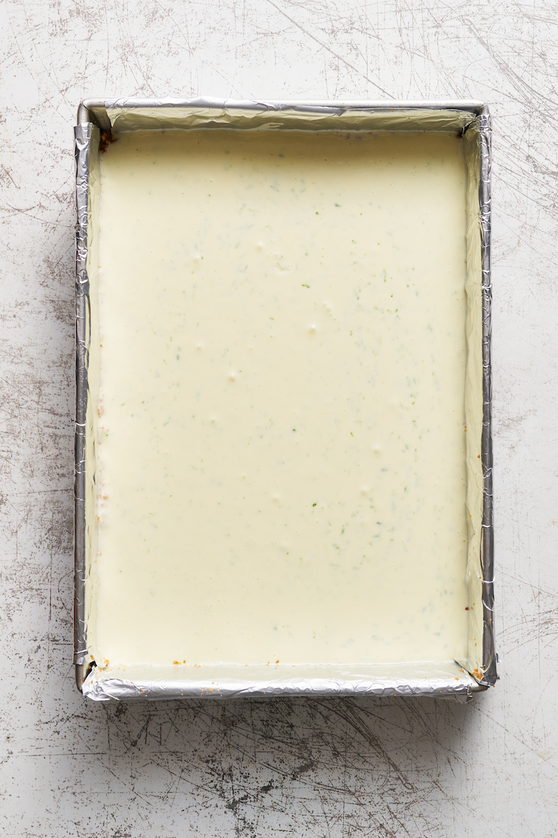 If you like key lime pie and cheesecake, you'll love key lime cheesecake bars! Featuring a crunchy graham cracker crust and a creamy key lime-flavored cheesecake filling, they're just begging to be topped with a dollop of whipped cream. Baked in a 9x13-inch baking pan, these bars easily serve a crowd.