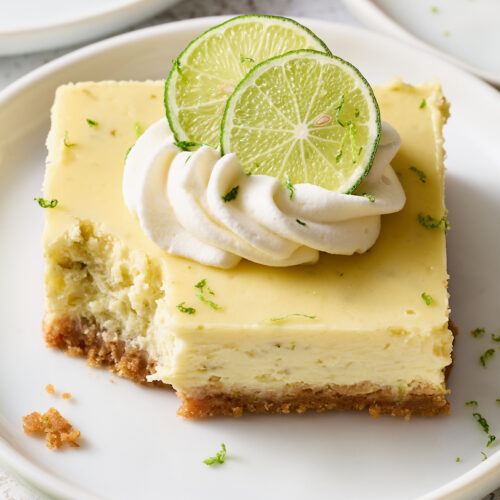 If you like key lime pie and cheesecake, you'll love key lime cheesecake bars! Featuring a crunchy graham cracker crust and a creamy key lime-flavored cheesecake filling, they're just begging to be topped with a dollop of whipped cream. Baked in a 9x13-inch baking pan, these bars easily serve a crowd.