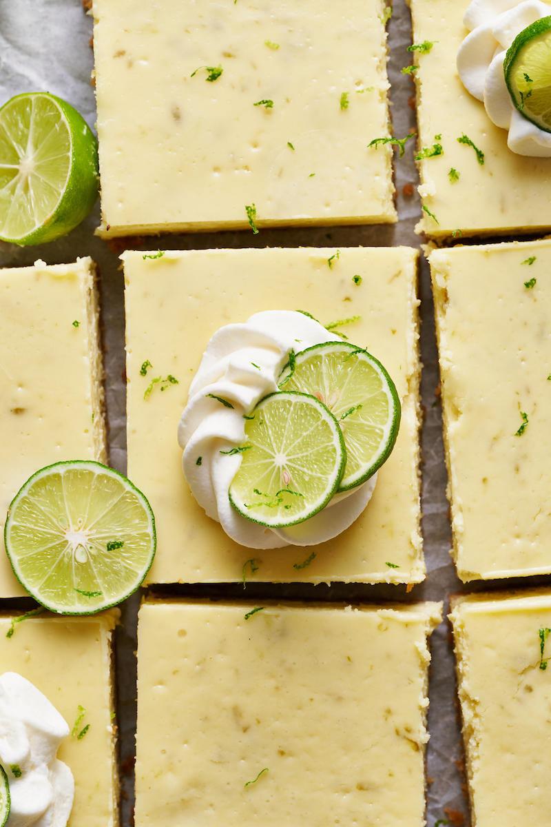 If you like key lime pie and cheesecake, you'll love key lime cheesecake bars! Featuring a crunchy graham cracker crust and a creamy key lime-flavored cheesecake filling, they're just begging to be topped with a dollop of whipped cream. Baked in a 9x13-inch baking pan, these bars easily serve a crowd.
