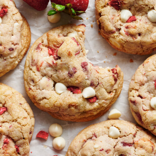 Strawberries and Cream Cookies bake up golden brown and are loaded with freeze dried strawberries (they pack in a ton of strawberry flavor) and white chocolate chips! Pretty, pink, and sure to please, these cookies will quickly become a family favorite. No cookie dough chilling required!