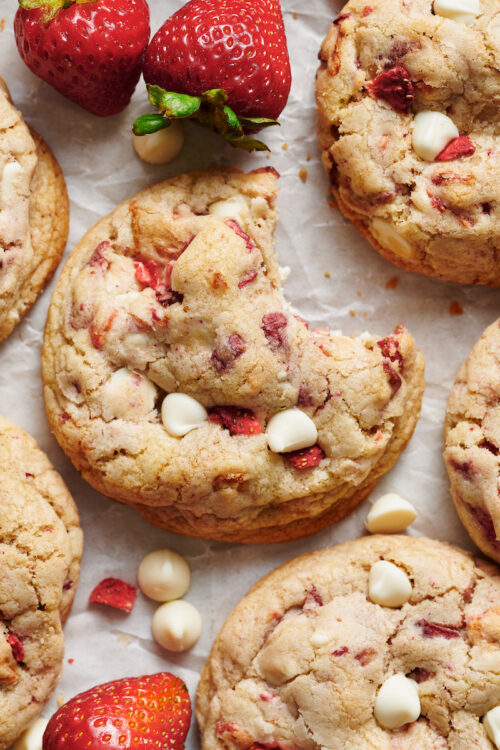 Strawberries and Cream Cookies bake up golden brown and are loaded with freeze dried strawberries (they pack in a ton of strawberry flavor) and white chocolate chips! Pretty, pink, and sure to please, these cookies will quickly become a family favorite. No cookie dough chilling required!