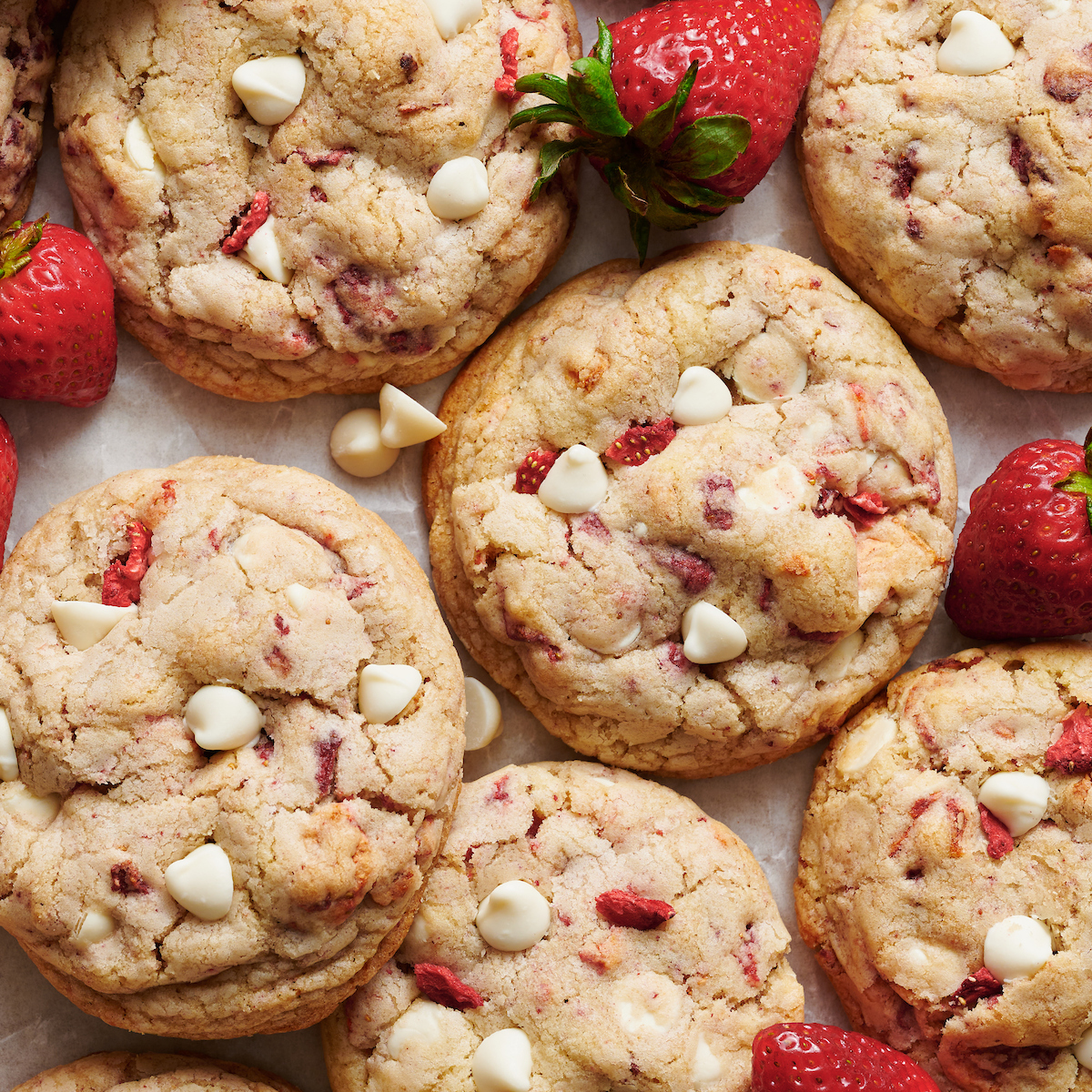 Strawberry cookies with freeze dried strawberries and white chocolate chips on top.