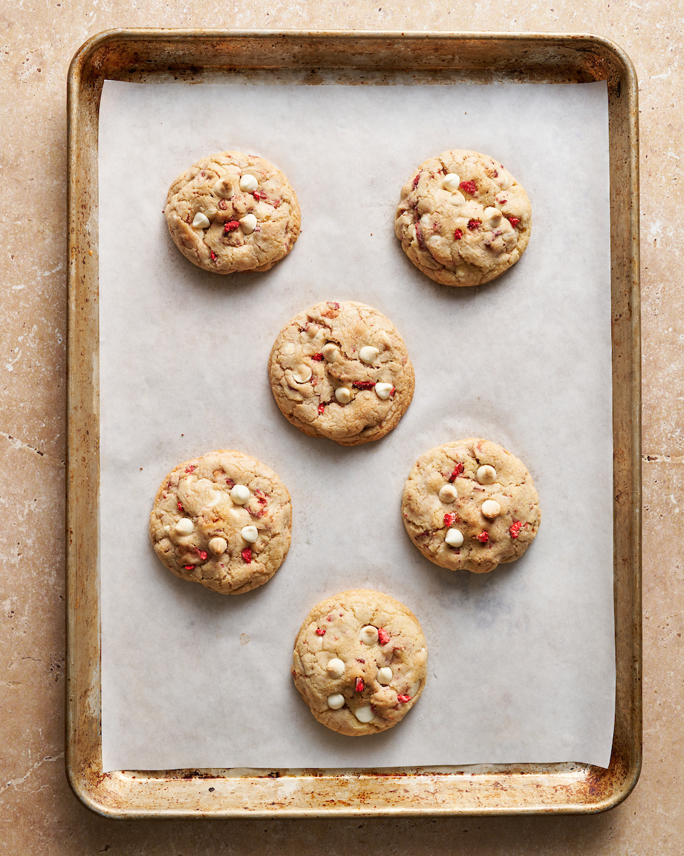 Strawberries and Cream Cookies on white parchment paper.