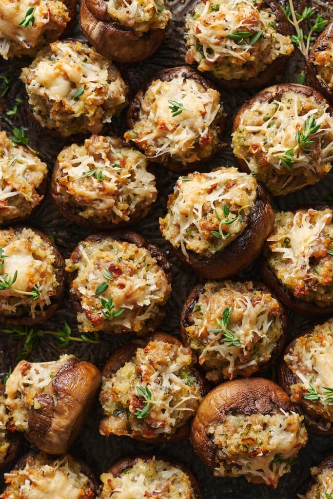 Stuffed mushroom on a baking sheet.