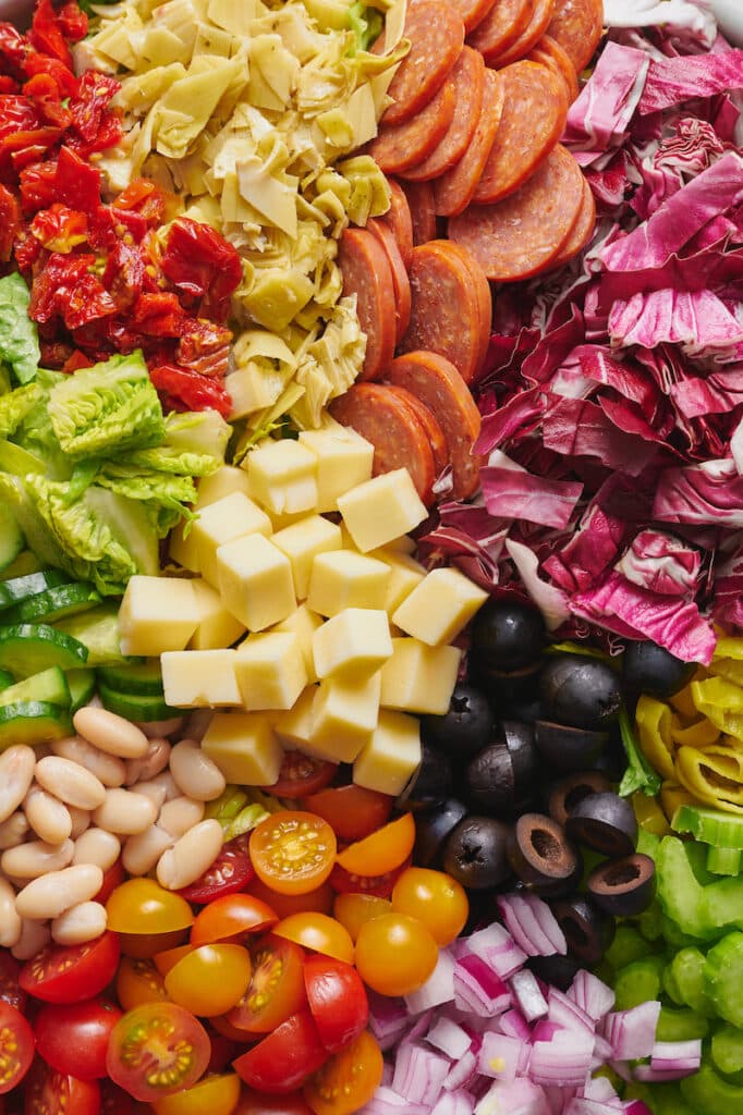 Big bowl of chopped salad ingredients ready to be tossed together.