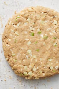 Scone dough kneaded into an 8-inch disc.