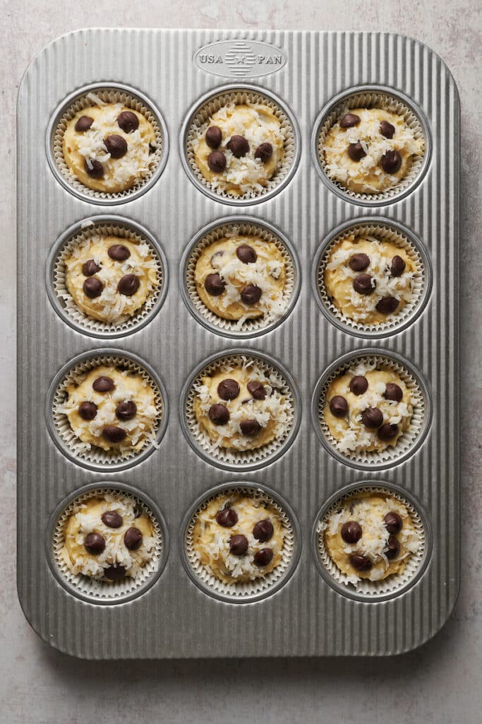 Coconut muffins in muffin pan.